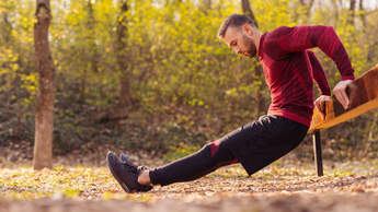 Active,Man,Doing,Bodyweight,Dips,While,Working,Out,Outdoors,In