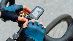 Cyclist's,Hands,Use,A,Computer,For,A,Bicycle,,Close-up,Photo.