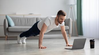 Happy,Middle-aged,Man,In,Sportswear,Doing,Push-ups,,Using,Laptop,,Having