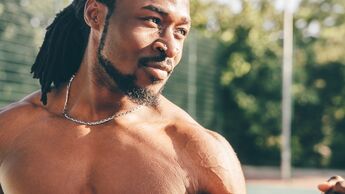 Young and healthy athletic man is exercising outdoors in Summer shirtless